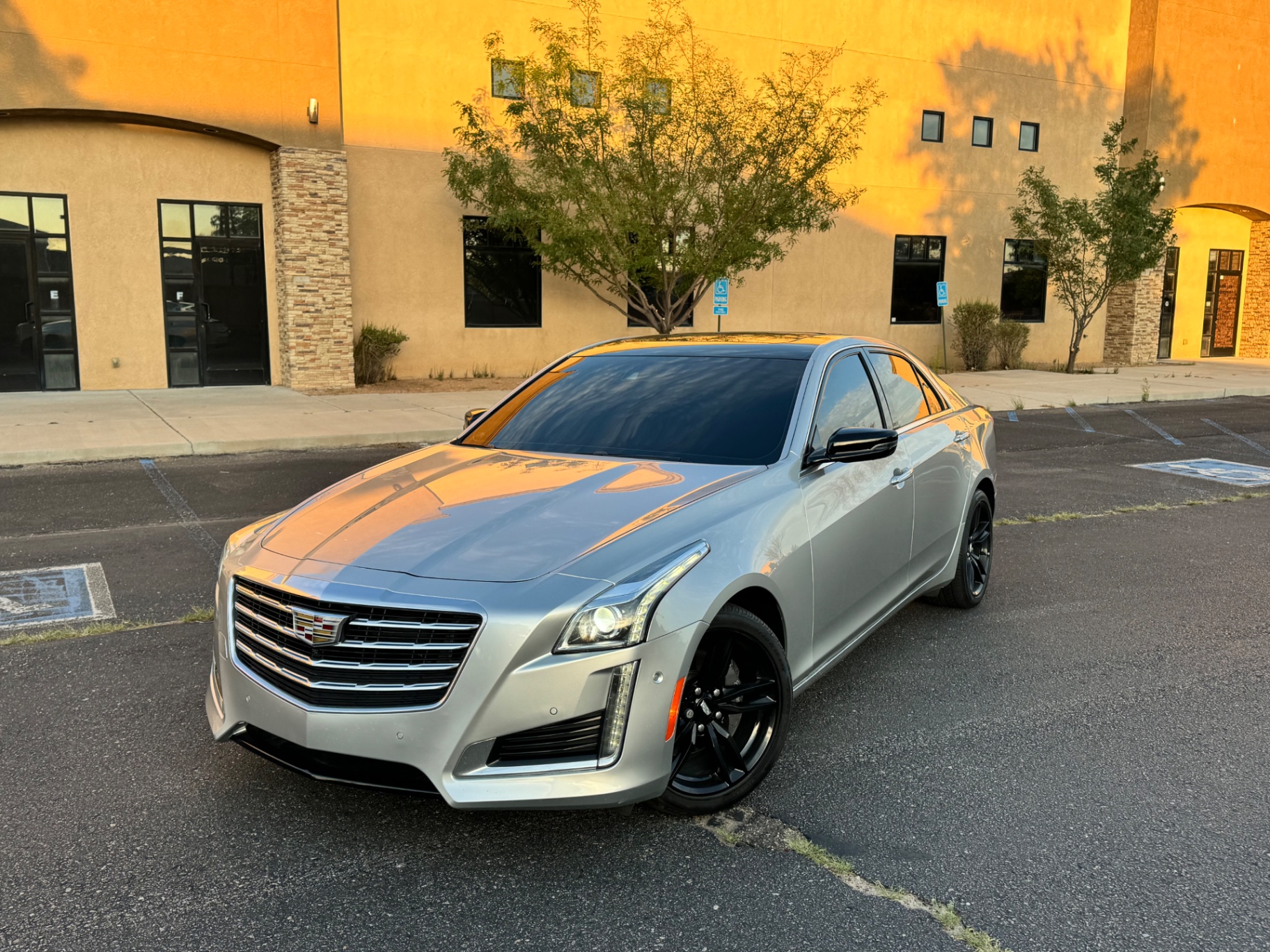 Silver Cadillac CTS detailed with black wheels