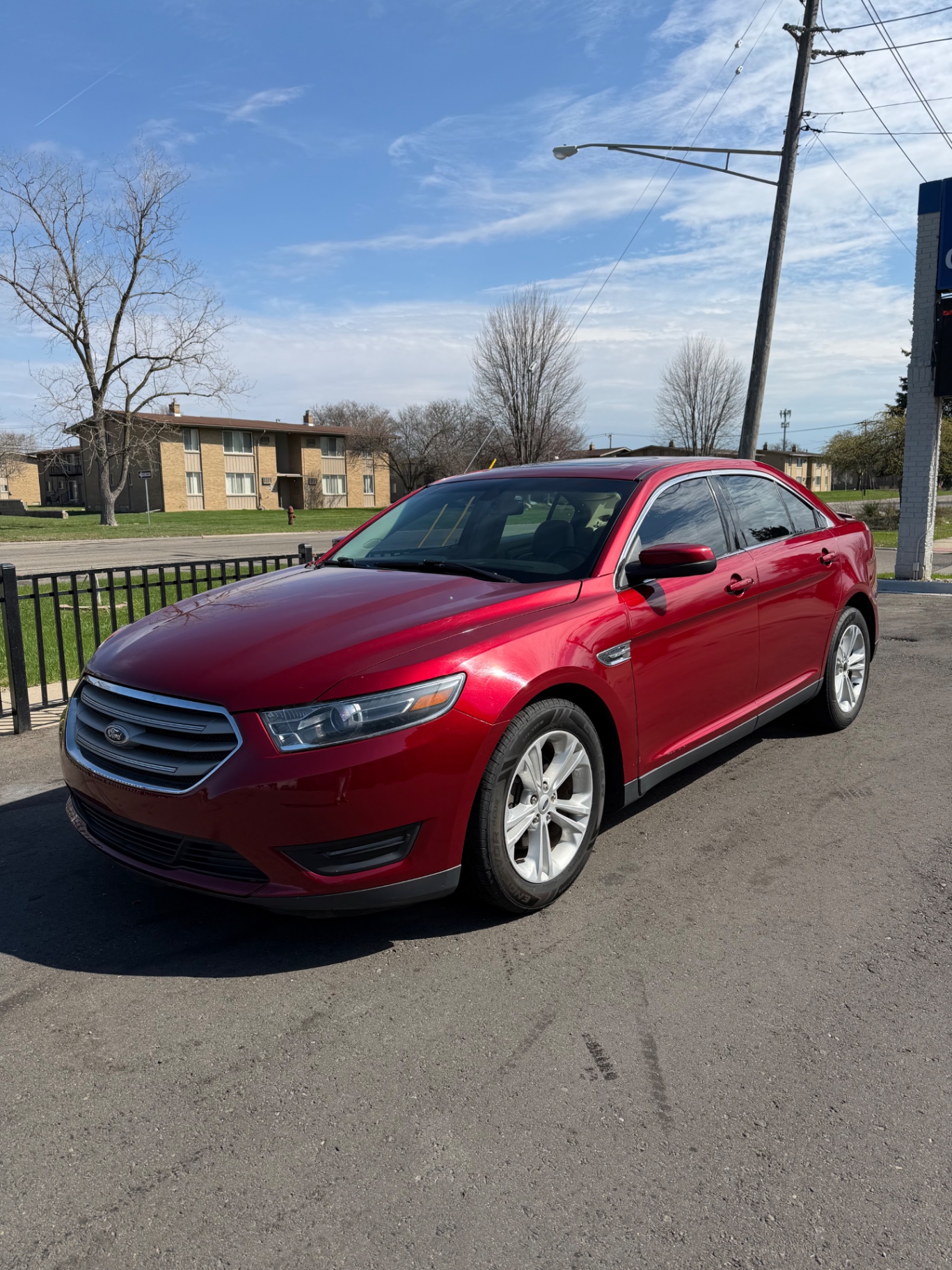 Red Ford Taurus detailed exterior side view
