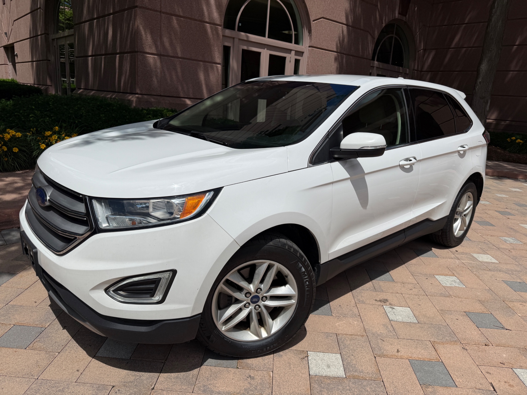 White Ford Edge detailed with glossy paint finish